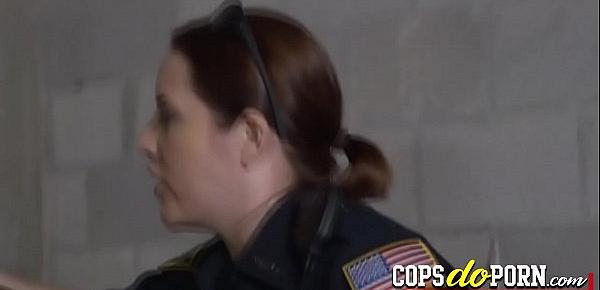  Two horny female cops are ready to fuck with a black criminal in jail.
